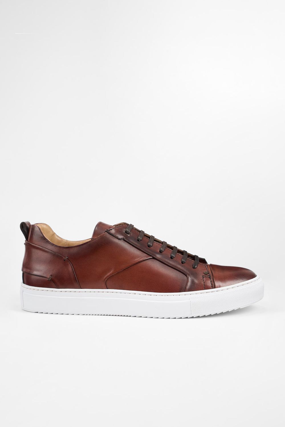 SKYE cognac studded patina sneakers.