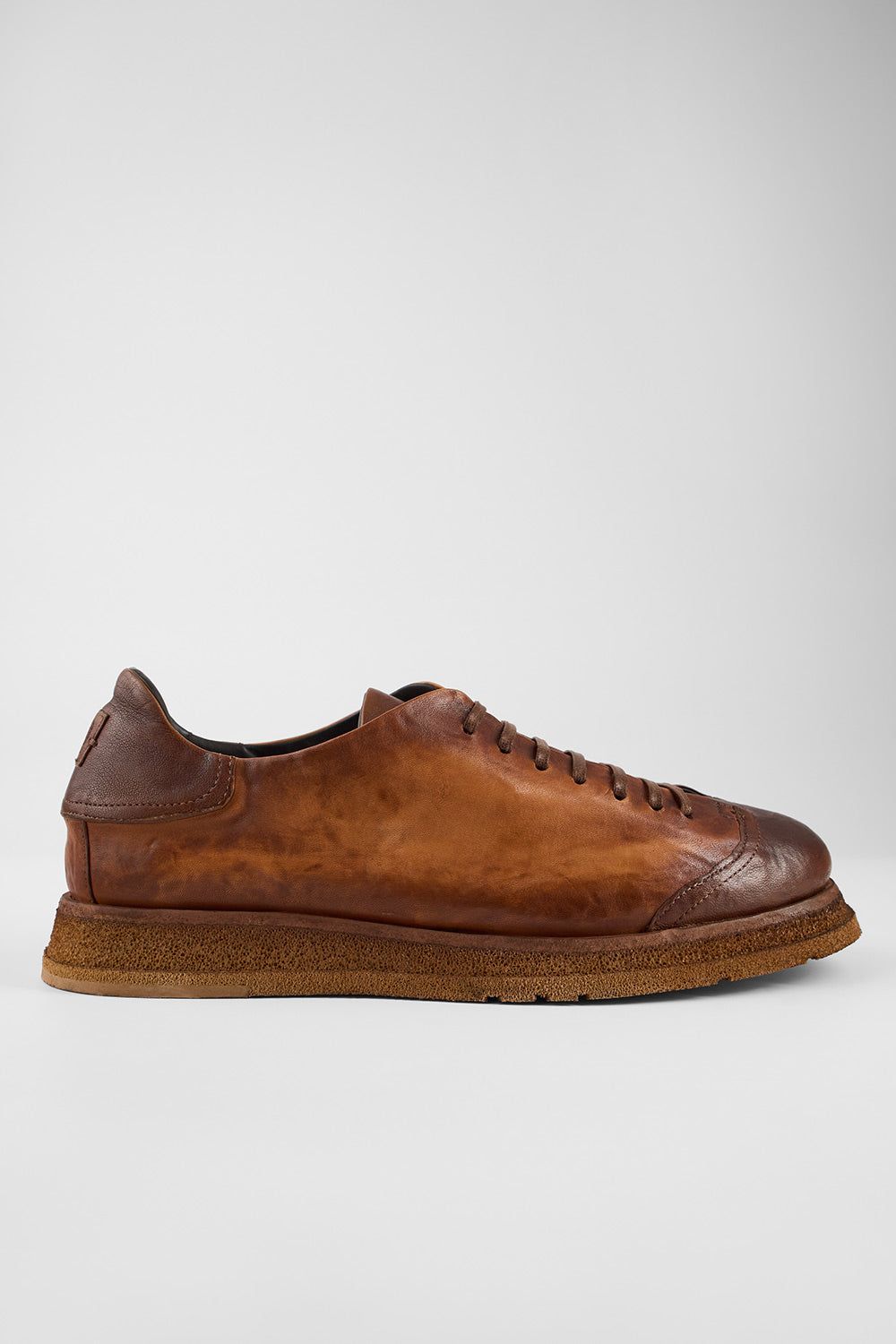 AJAX cognac distressed lightweight hybrid sneakers.