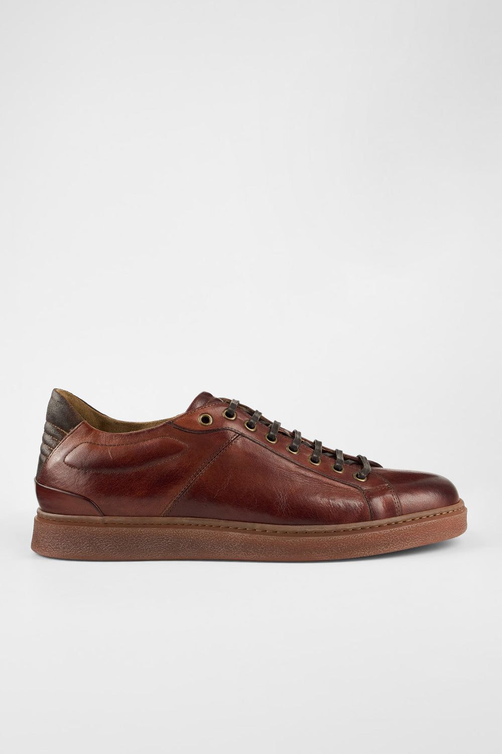 CREED cognac distressed sneakers.